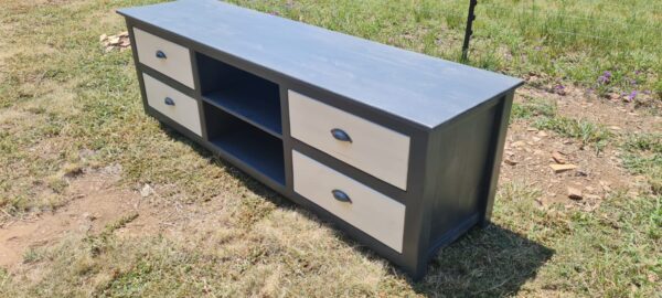 Grey and white wooden tv unit with 4 drawers side view angle