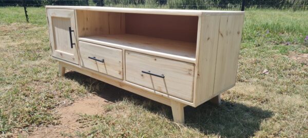 Raw wooden tv unit with 2 drawers and 1 cupboard side view