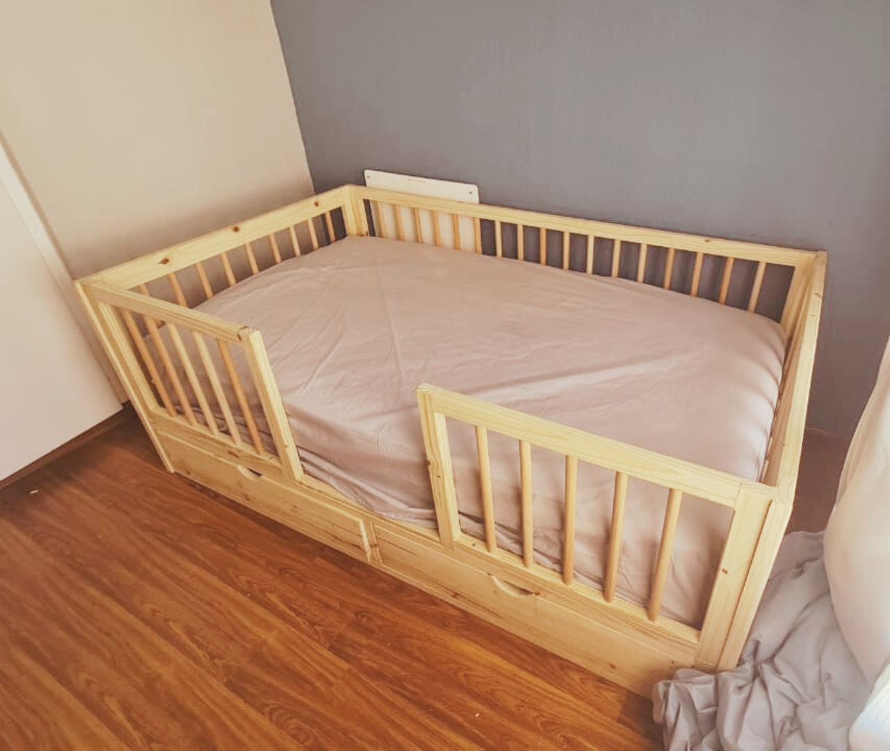 raw wood rail bed with storage drawers