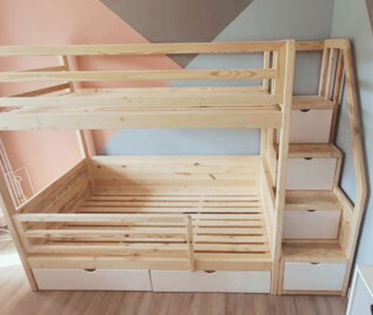 raw and white wooden bunk beds with step drawers