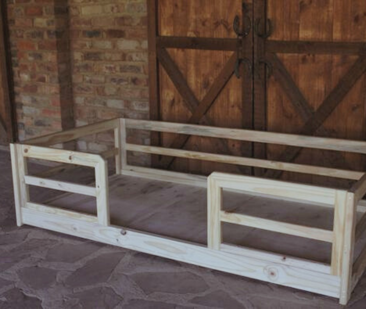 Crib to bed raw wooden bed displayed against wooden door