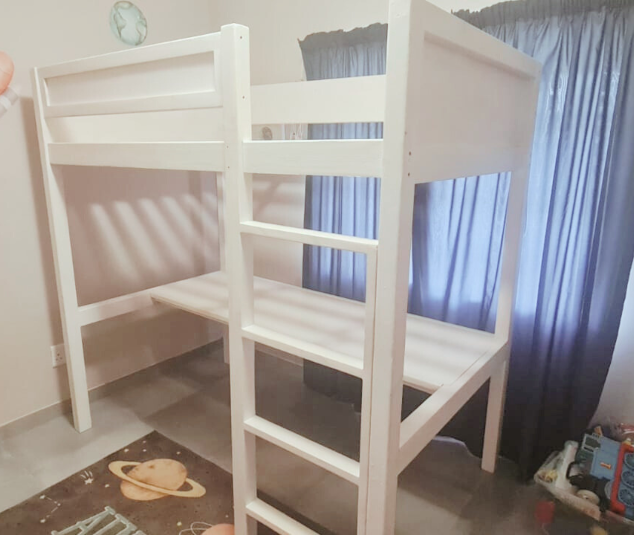 white bunk bed with desk underneath