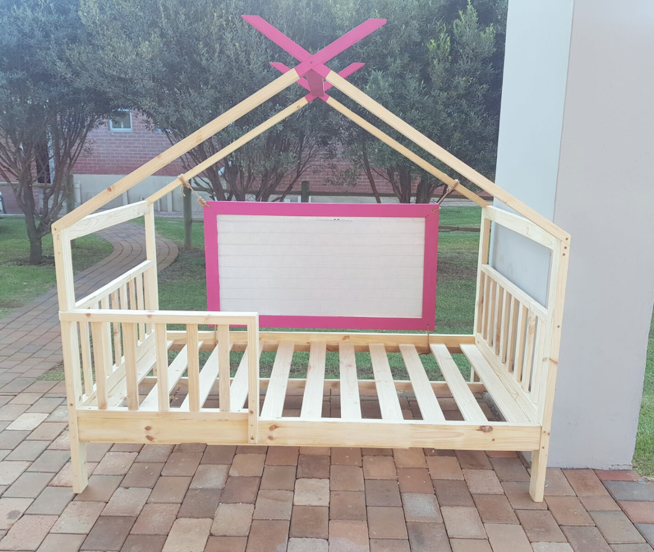 Raw pine with pink painted tips inverted teepee bed