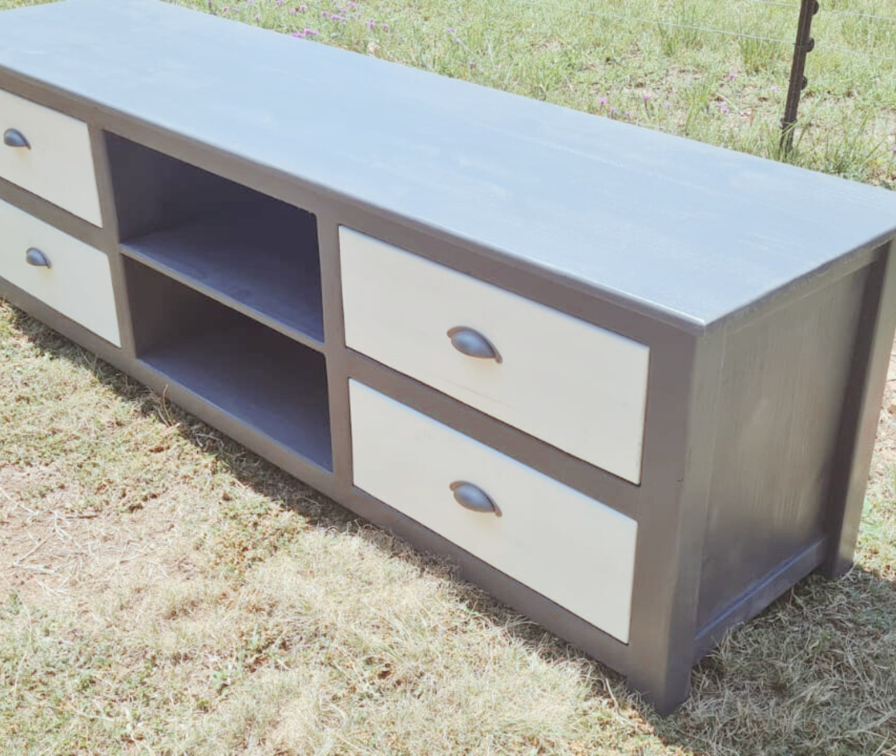 Grey plasma unit with white drawers