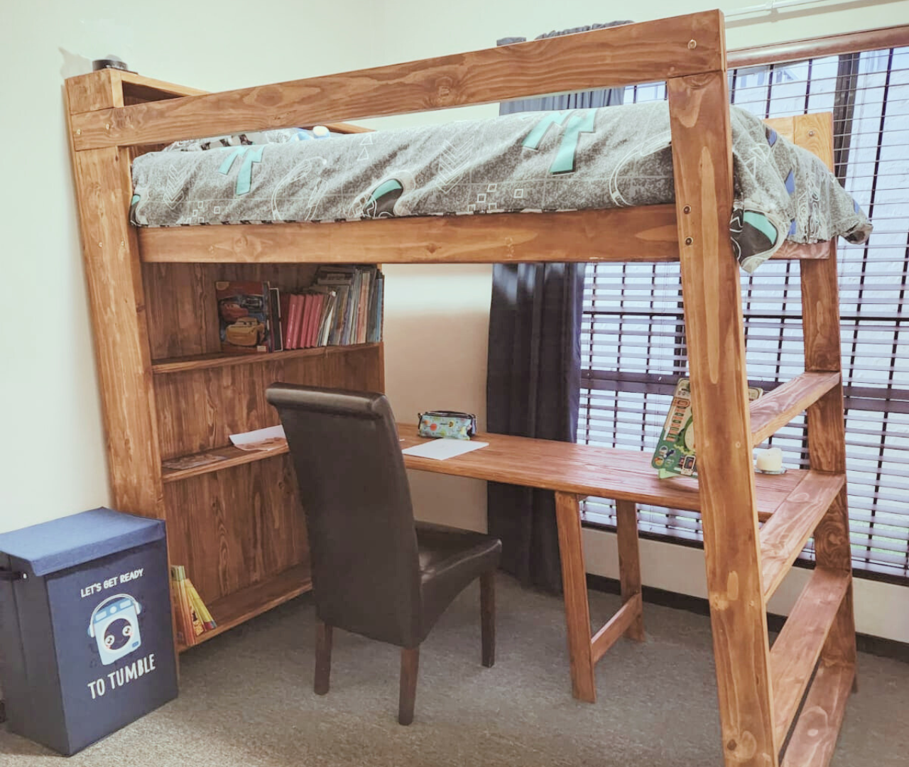 stained wooden loft bunk bed with desk