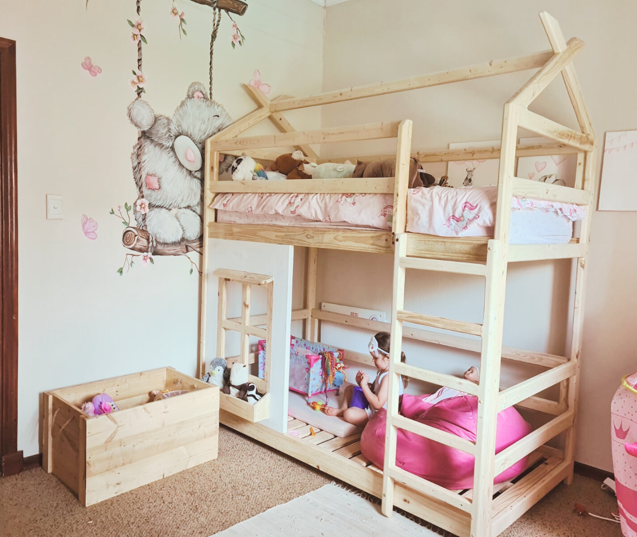 raw wood double teepee bunk bed with pink bedding