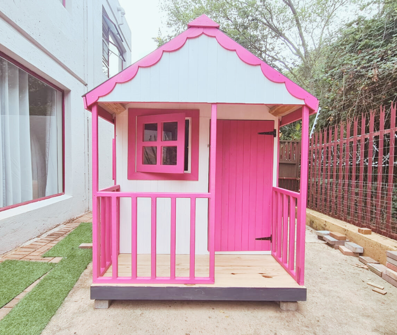 Pink and white playhouse