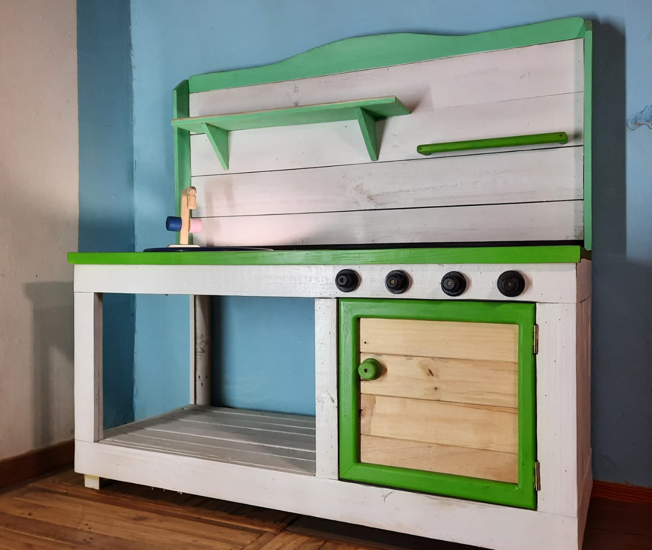 Green and white mud kitchen