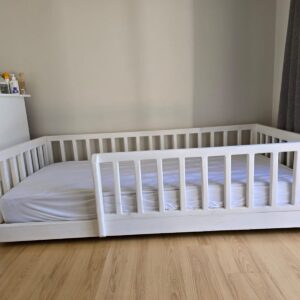 White wooden railed kids bed