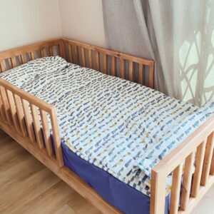 wooden railed kids bed
