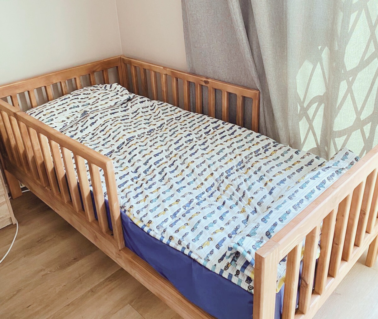 wooden railed kids bed