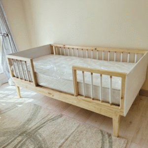 White wooden railed kids bed