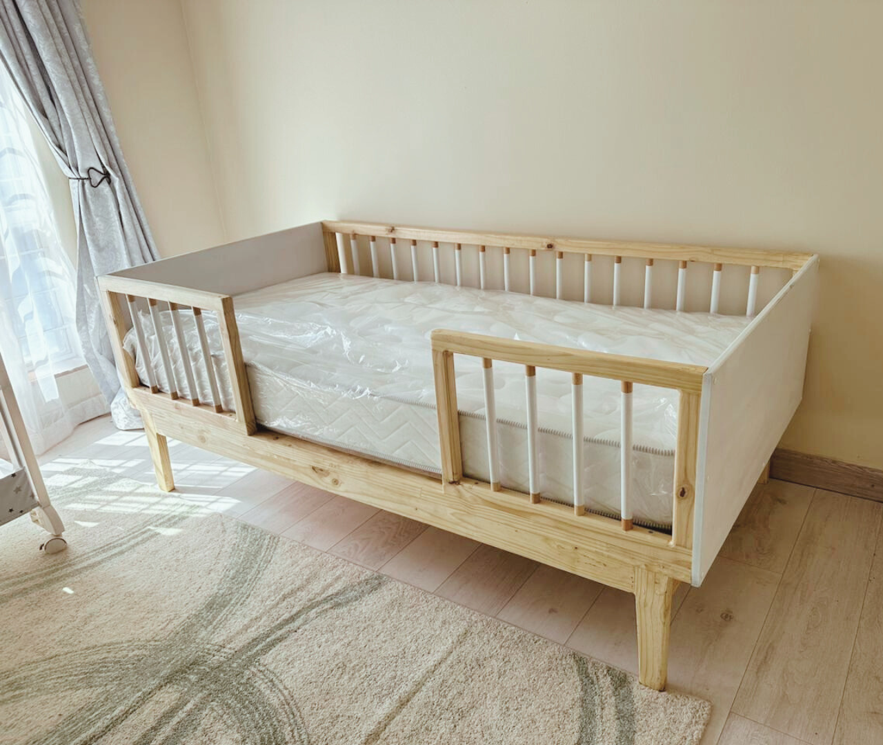 White wooden railed kids bed
