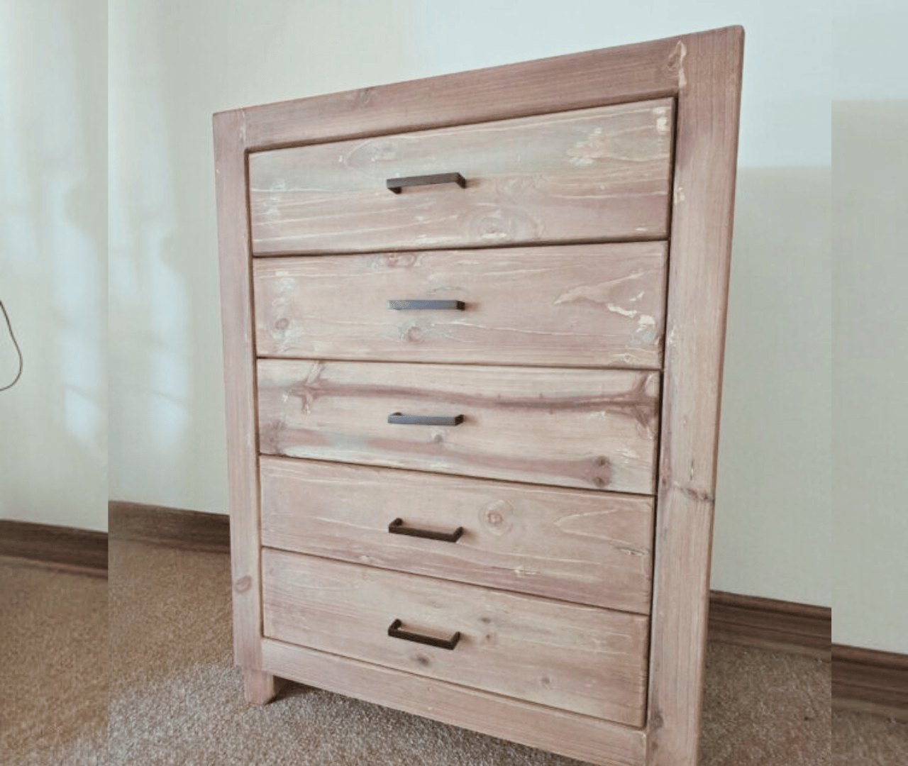 wooden railed kids bed with storage drawers