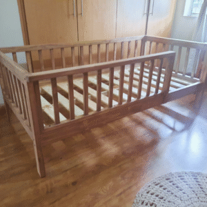 wooden railed kids bed