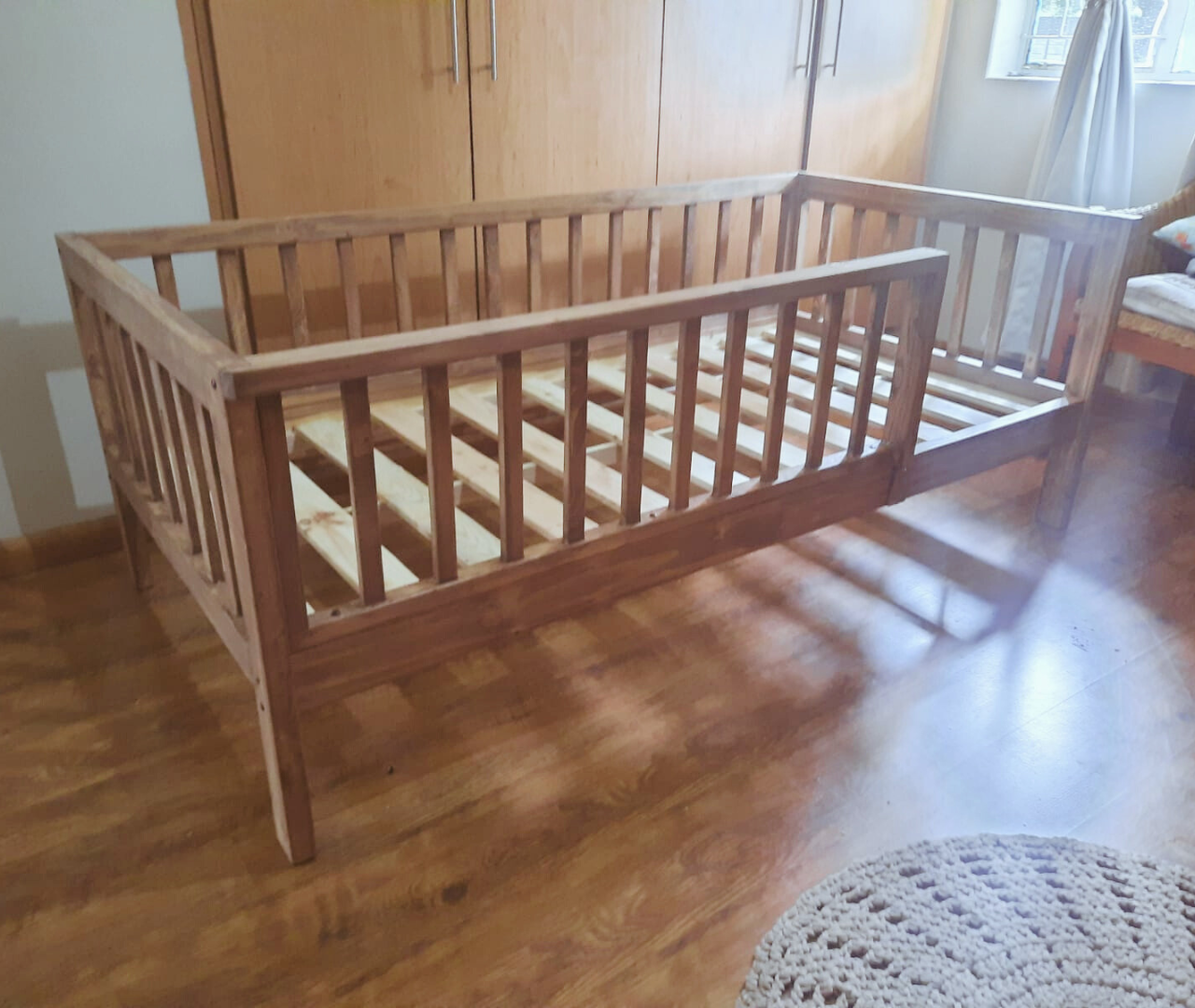 wooden railed kids bed