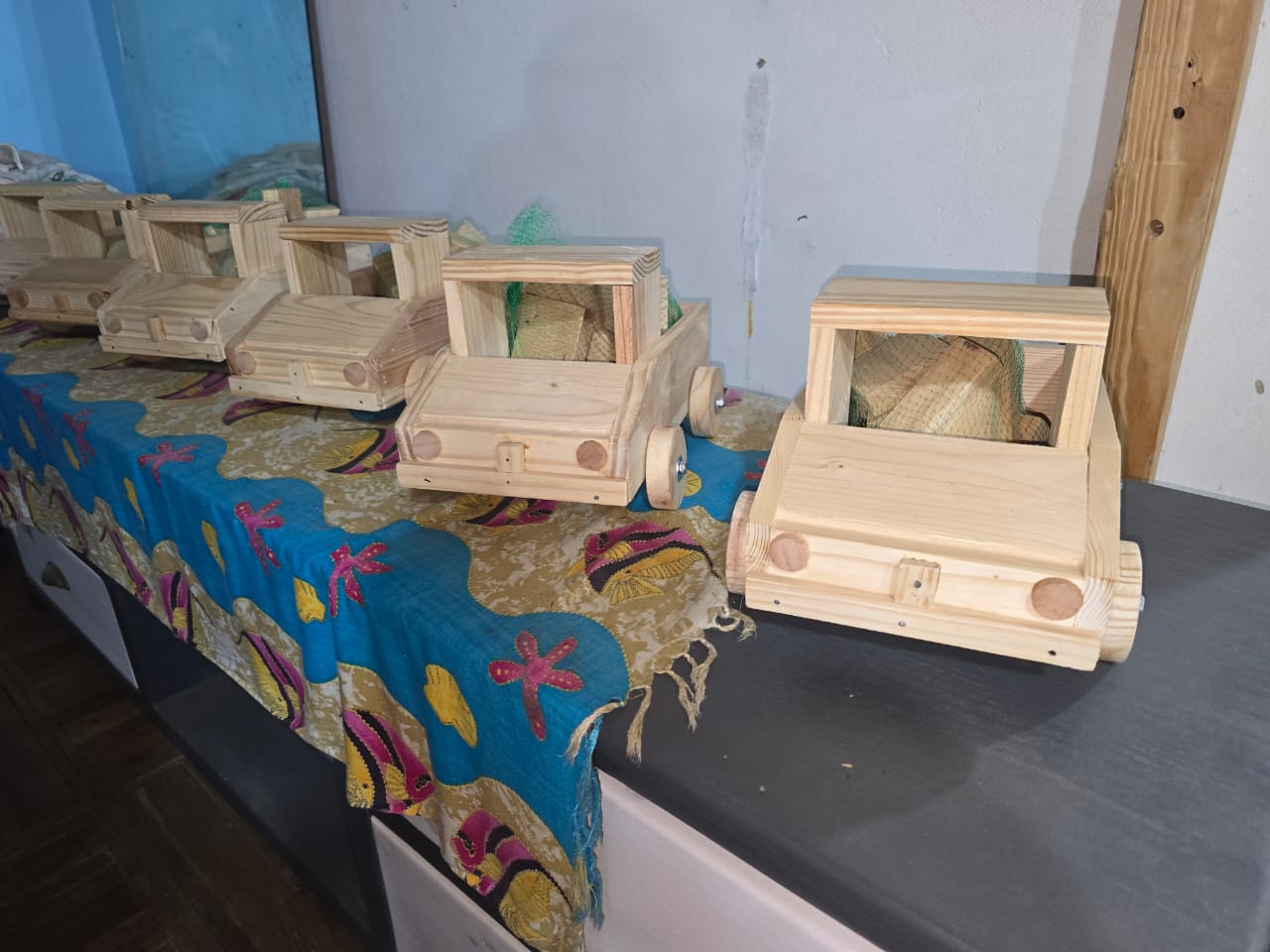 small wooden hand crafted wooden cars