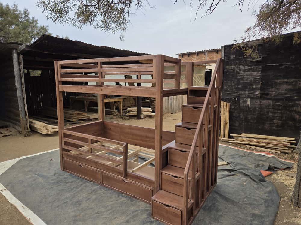 bunk bed with steps stained shown outdoors