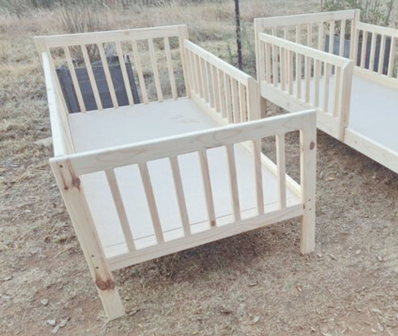 Wooden rail bed with extended headboard